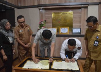 Pemkab Muaro Jambi Bersama KPUD Penandatanganan NPHD Dana Pilkada Tahun 2024